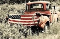 American flag tailgate old red truck