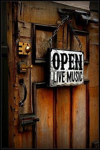 open live music sign on wooden door
