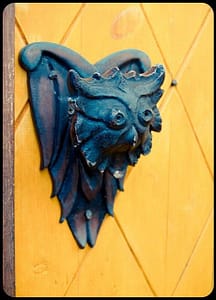 blue owl knob on yellow door