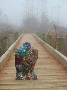 mosaic torso back on bridge in fog