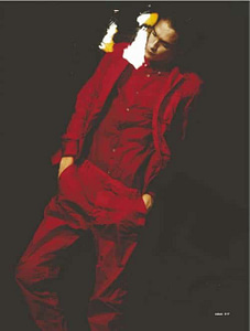 thin dark man in red outfit