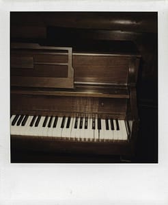 dark brown upright piano