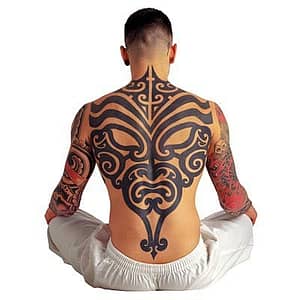 black tribal back tattoo on seat guy