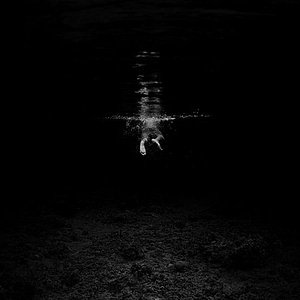 feet of swimmer in dark pool