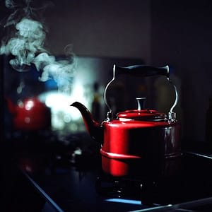 red teakettle on stove