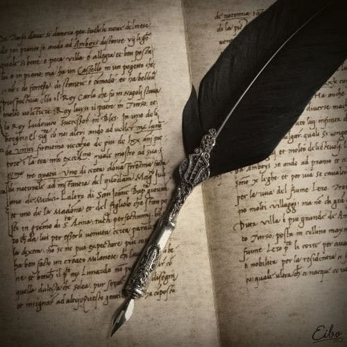 black feather pen on handwritten journal