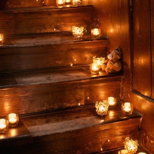 candles lighting brown stairs