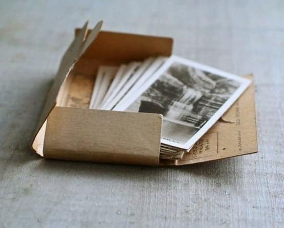 an open packet of old film-style photographs